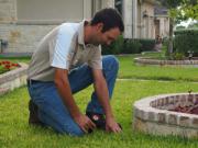 Jack is installing a new sprinkler head in Pasadena TX